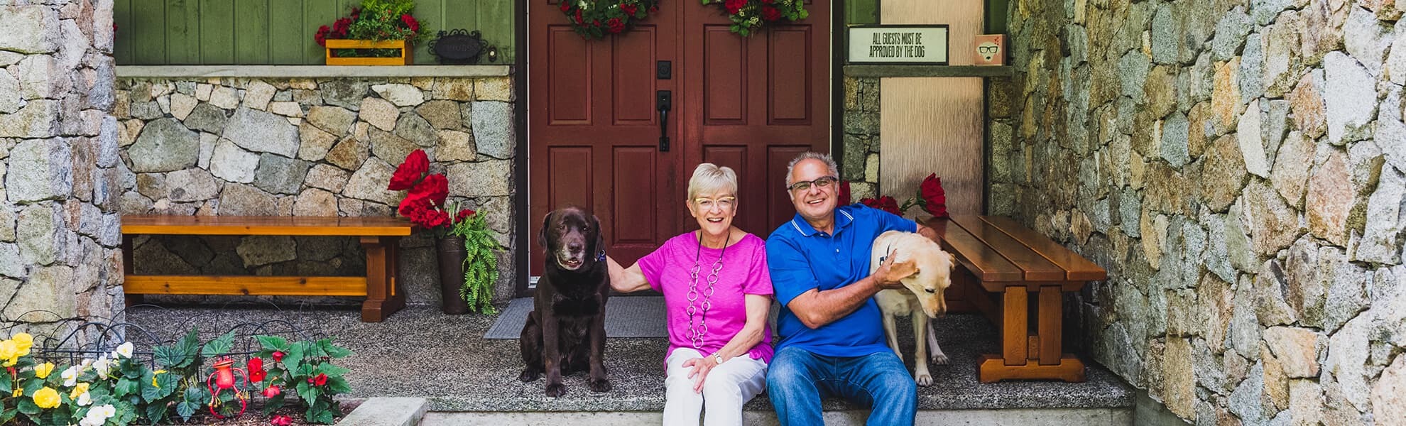 Cathy and Erroll sitting on front step